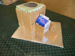 Covering Gingerbread base with grahm crackers
