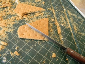 Cutting grahm crackers for gingerbread house