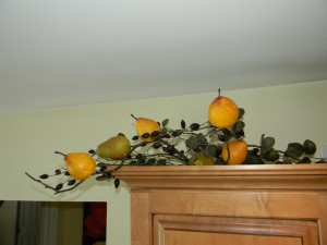 Decorating Above Kitchen Cabinets, adding Pears and Olives