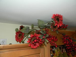 Decorating Above Kitchen Cabinets, adding red sunflowers