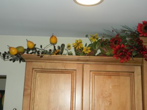 Decorating above kitchen cabinets, left of sink
